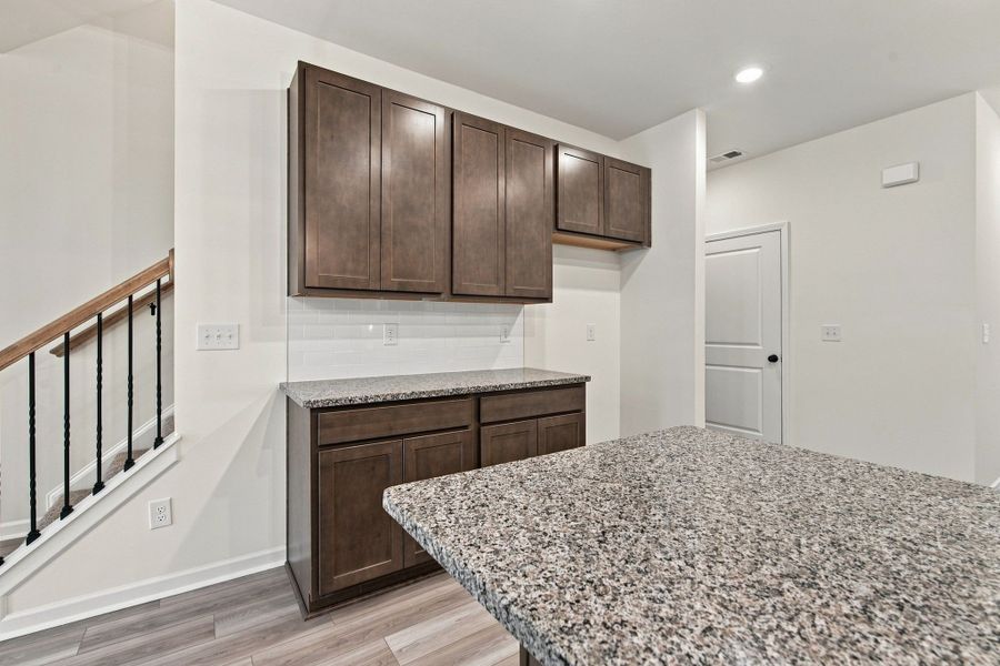 These pictures are of another unit of the same floor plan. Design selections will vary.