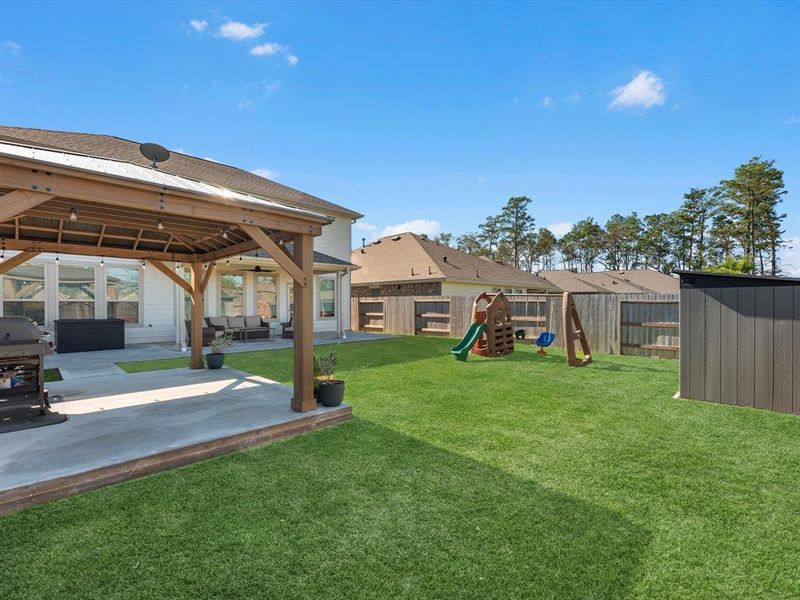 Two covered concrete patio extensions, a shed, and ample green space!