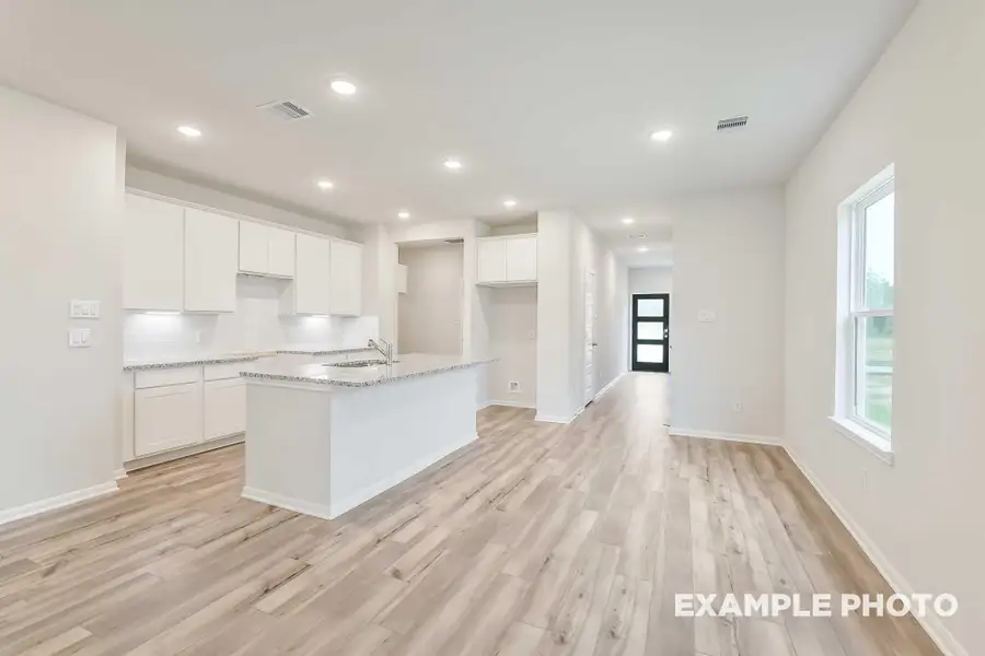Furnished interior view inside a new home in Caney Creek Place, Conroe (Image 6).