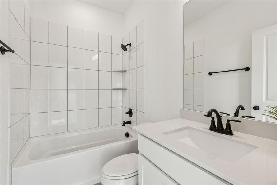 Guests will feel right at home in this beautifully finished guest bath.
