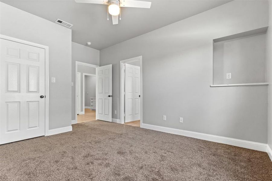 Unfurnished bedroom #3 featuring light colored carpet and a ceiling fan