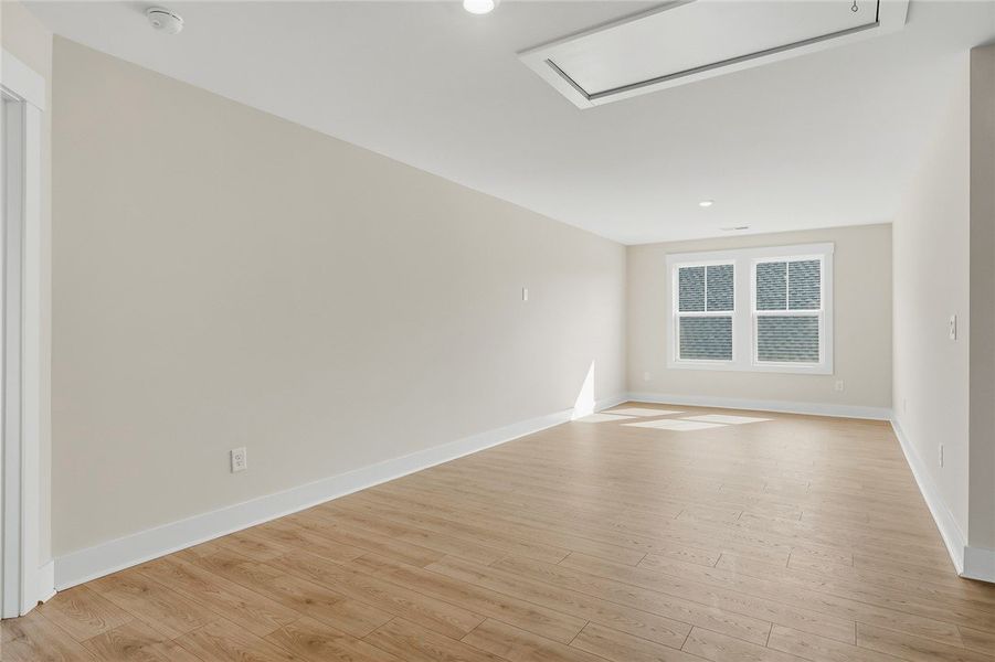 Gleaming wood floors run through this versatile up