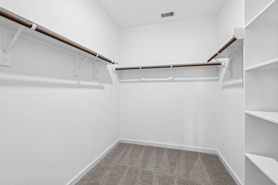 Walk-in closet in the primary suite Walk-in closet in the primary suite