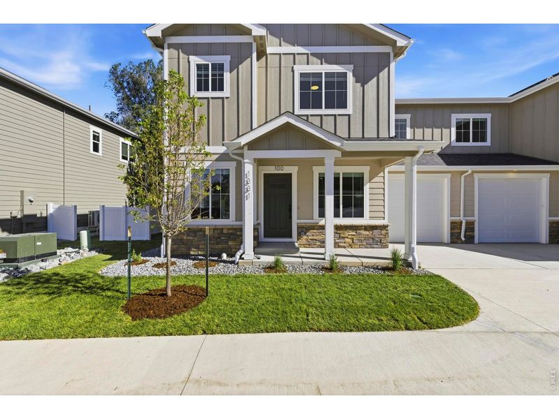 Front exterior of a new home in , Loveland, CO, highlighting curb appeal (Image 25).