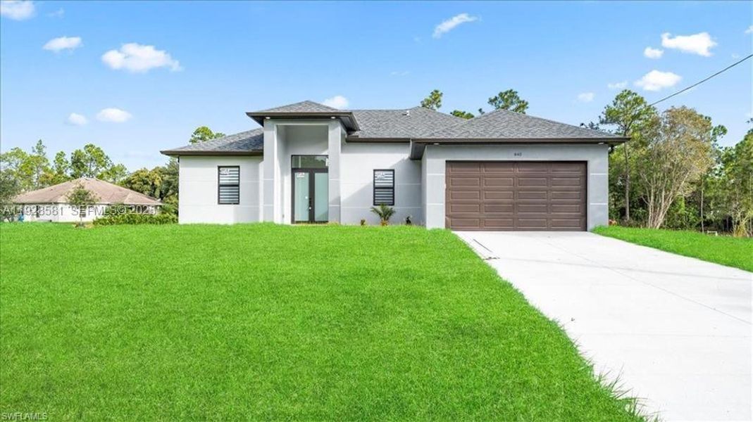 Front exterior of a new home in , Lehigh Acres, FL, highlighting curb appeal (Image 20).