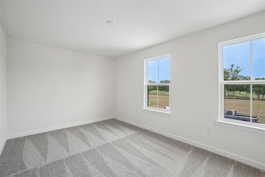 Spacious, unfurnished interior of a new home in Grasslands West, Lakeland (Image 39).