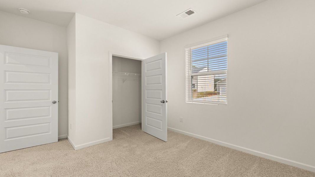 Representative unfurnished interior of a home built from the Kerry by D.R. Horton in Champion's Run, Lithonia (Image 12).
