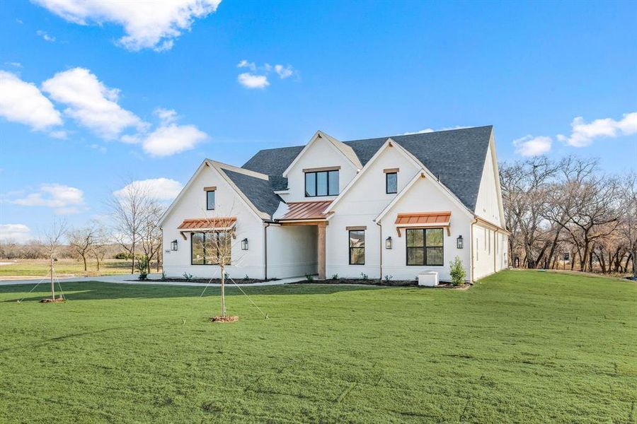 Front exterior of a new home in Rolling Creek Ranch, Aledo, TX, highlighting curb appeal (Image 20). Front exterior of a new home in Rolling Creek Ranch, Aledo, TX, highlighting curb appeal (Image 20).
