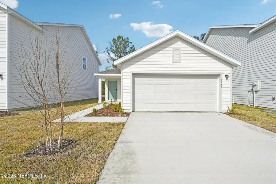 Front exterior of a new home in Kings Landing, Jacksonville, FL, highlighting curb appeal (Image 6).