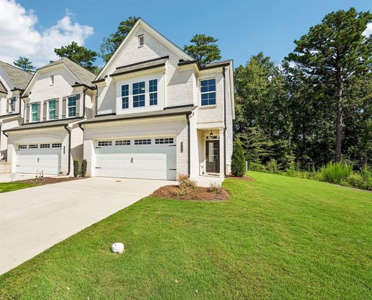Front exterior of a new home in , Duluth, GA, highlighting curb appeal (Image 2). Front exterior of a new home in , Duluth, GA, highlighting curb appeal (Image 2).