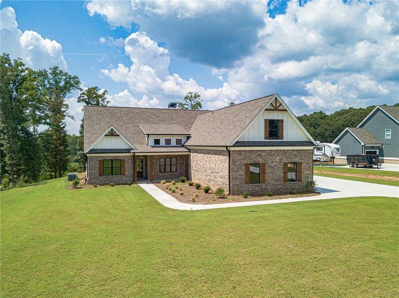 Front exterior of a new home in , Monroe, GA, highlighting curb appeal (Image 1). Front exterior of a new home in , Monroe, GA, highlighting curb appeal (Image 1).