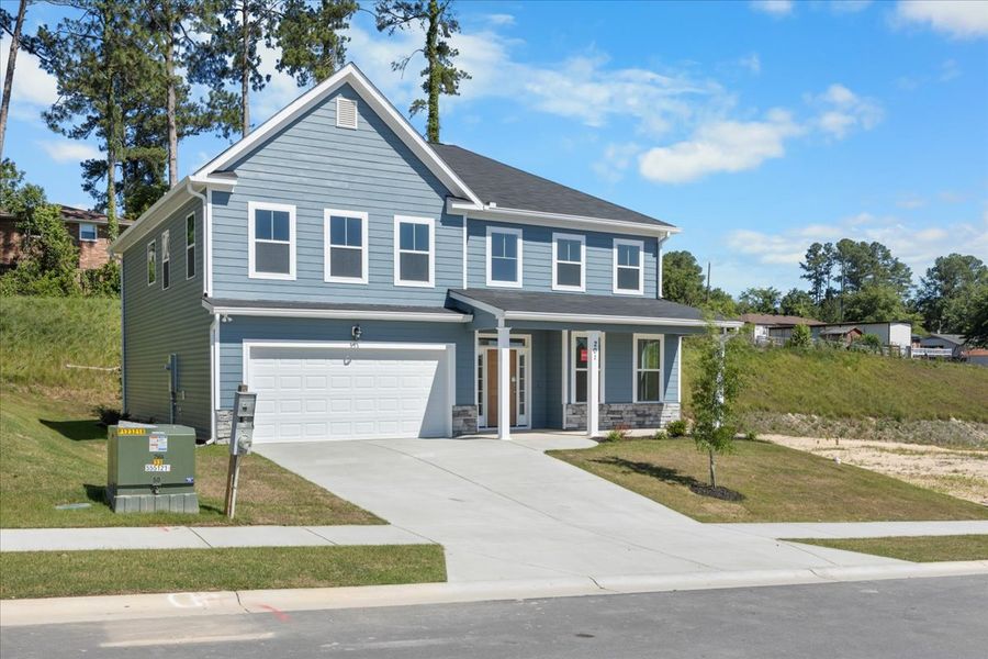 Front exterior of a new home in Forrest Bluff, North Augusta, SC, highlighting curb appeal (Image 22). Front exterior of a new home in Forrest Bluff, North Augusta, SC, highlighting curb appeal (Image 22).