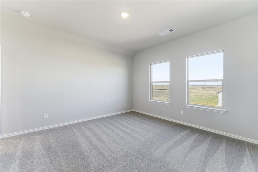 Spare room with light colored carpet and recessed lighting