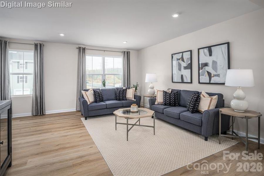 Sun-filled great room with open floor plan — ideal for entertaining and everyday comfort.
