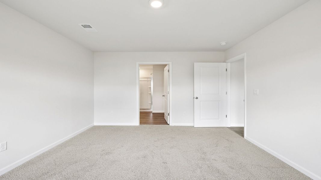 Spacious, unfurnished interior of a new home in Bentley Park, Greenwood (Image 28).