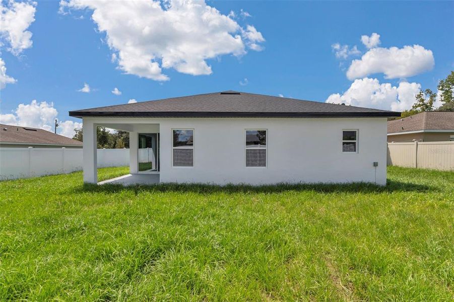 Exterior details and patio area of a home in , Summerfield (Image 25).