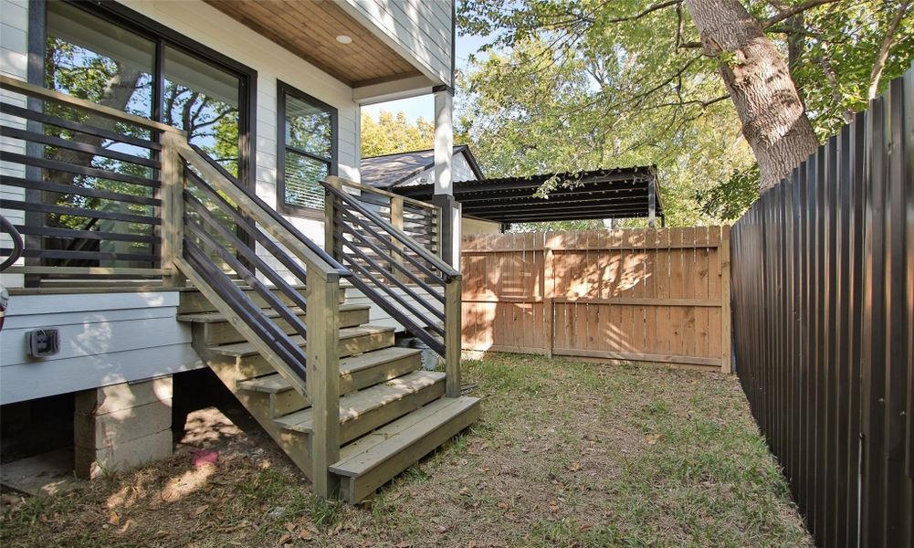 Stairs leading down to the back yard perfect for pets. Stairs leading down to the back yard perfect for pets.