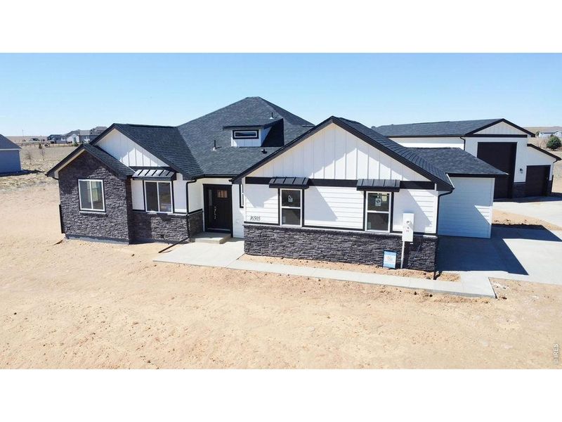 Front exterior of a new home in , Platteville, CO, highlighting curb appeal (Image 19).