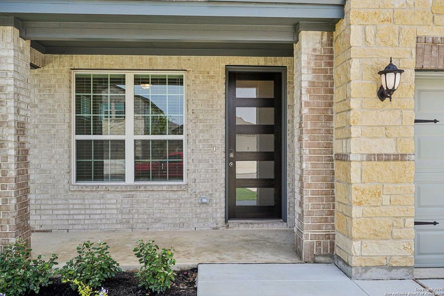 Front exterior of a new home in Sagebrooke - Premier Series, San Antonio, TX, highlighting curb appeal (Image 24). Front exterior of a new home in Sagebrooke - Premier Series, San Antonio, TX, highlighting curb appeal (Image 24).