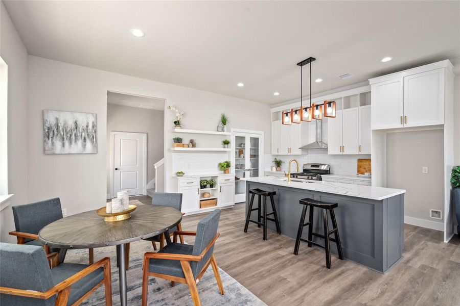 Tons of Natural Lighting coming in from glass door with view to back yard