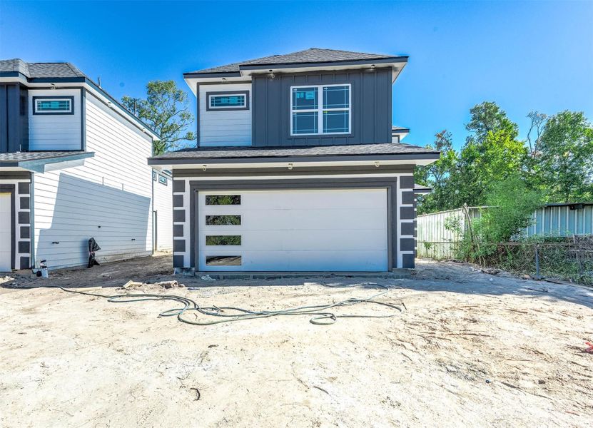 Front view of the home in progress, showcasing the elevation design as construction nears completion.