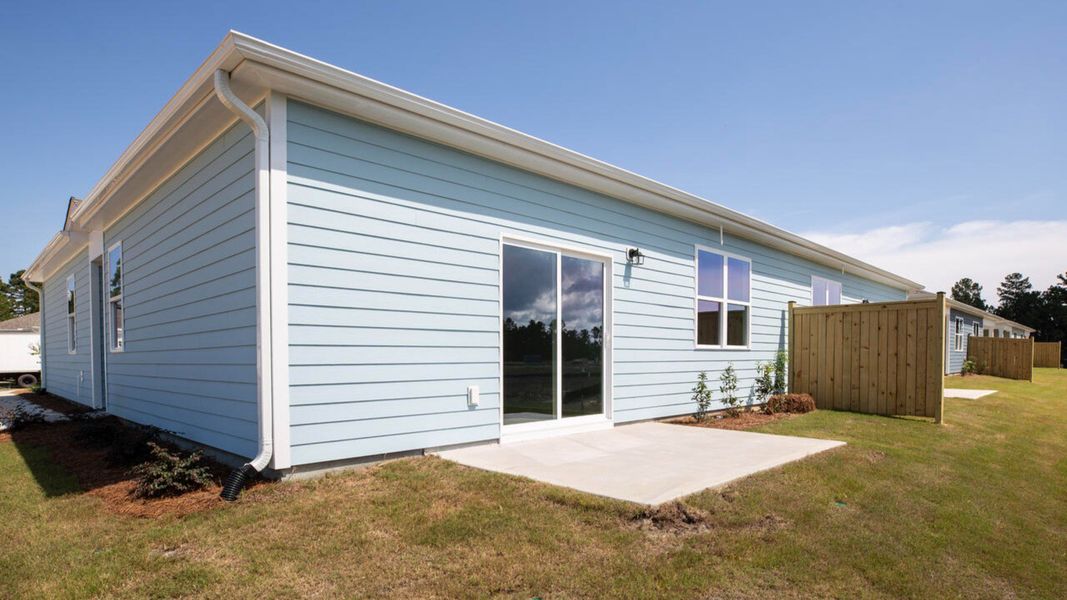 Exterior details and patio area of a home in Indigo Preserve Townhomes, Leland (Image 3).
