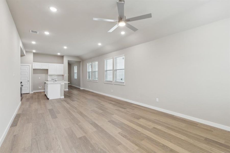 Open living space in in the Elm home plan by Trophy Signature Homes – REPRESENTATIVE PHOTO