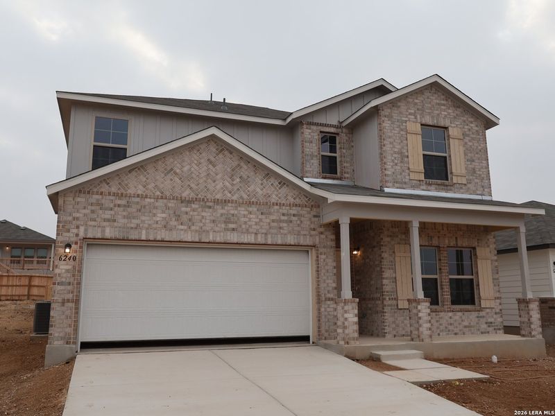 Front exterior of a new home in Mesquite Ridge, San Antonio, TX, highlighting curb appeal (Image 20).