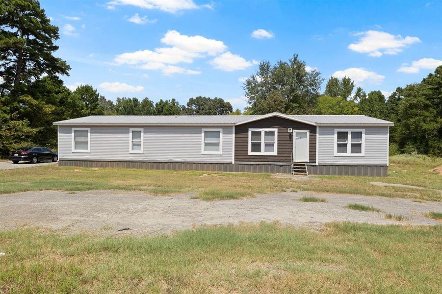 Front exterior of a new home in , Mount Pleasant, TX, highlighting curb appeal (Image 21).