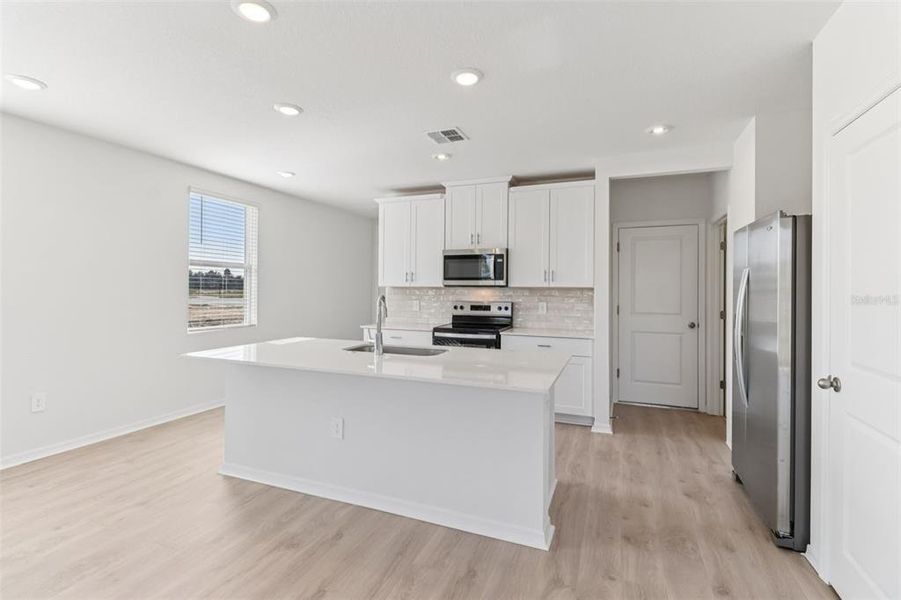 Furnished interior view inside a new home in The Reserve at Hammock Oaks Townes, Lady Lake (Image 7).