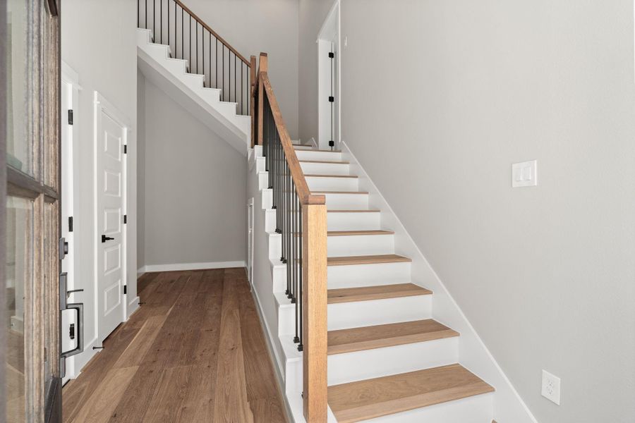 Upon entry, you're greeted by a beautiful entry on first level with spacious garage and convenient storage space.