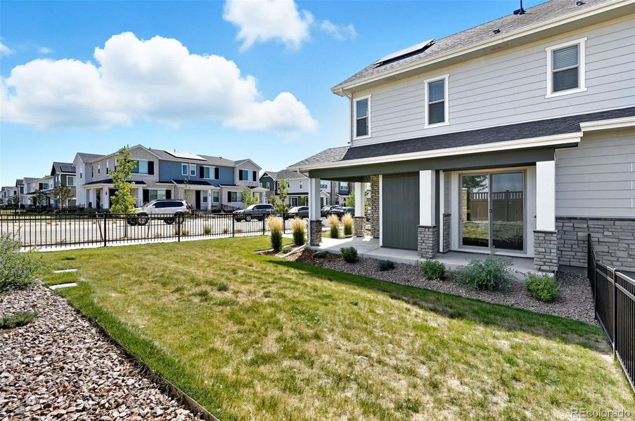 Private, fenced, side yard with sprinklers