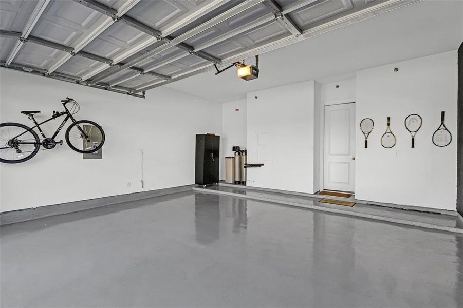 Garage featuring a garage door opener