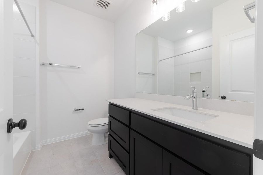 Furnished interior view inside a new home in The Hollows Canyon - 60', Lago Vista (Image 9).