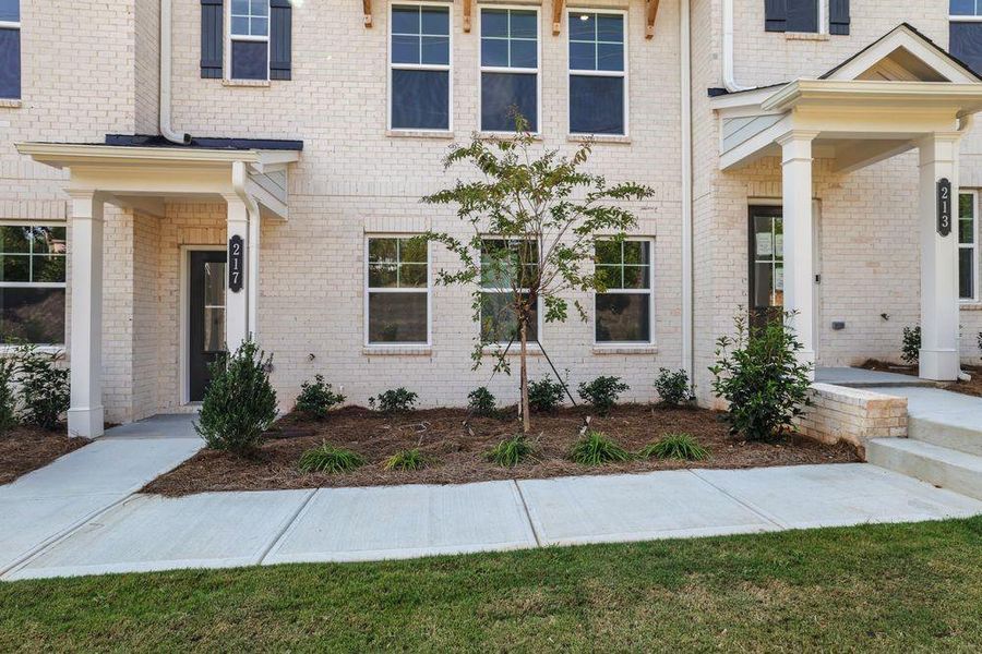 Front exterior of a new home in Somerset at Veterans Memorial, Mableton, GA, highlighting curb appeal (Image 20).