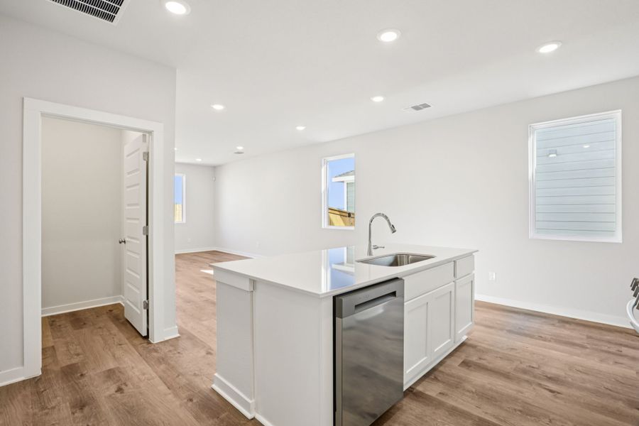 A kitchen with white cabinets. A kitchen with white cabinets.
