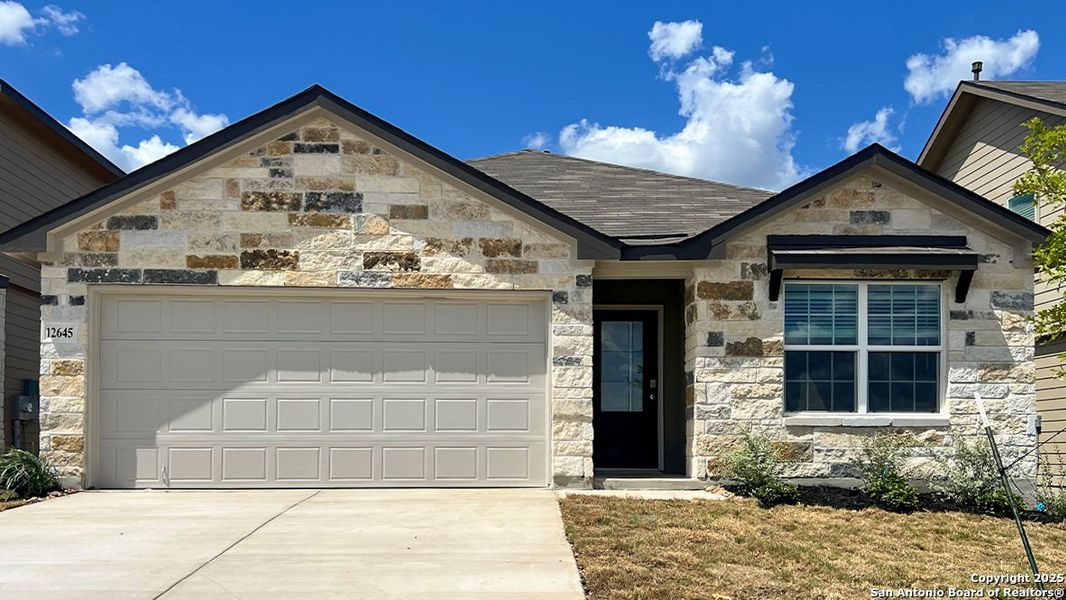 Front exterior of a new home in Avenida, Converse, TX, highlighting curb appeal (Image 14). Front exterior of a new home in Avenida, Converse, TX, highlighting curb appeal (Image 14).