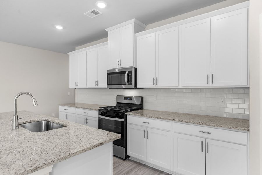 Furnished interior view inside a new home in Cypress Ridge - The Coastline Series, Longs (Image 9).