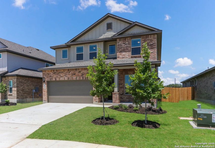 Front exterior of a new home in Buffalo Crossing – New Phase Now Preselling, Cibolo, TX, highlighting curb appeal (Image 2).