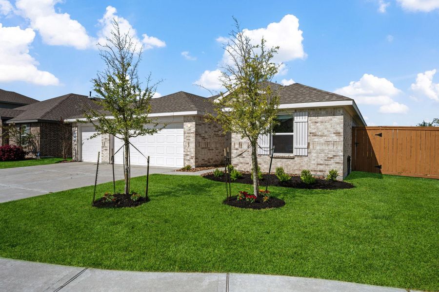 Front exterior of a new home in River Ranch Meadows, Dayton, TX, highlighting curb appeal (Image 21).