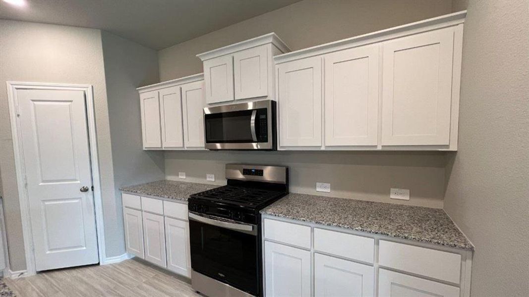 Furnished interior view inside a new home in Rosewood at Beltmill, Fort Worth (Image 4). Furnished interior view inside a new home in Rosewood at Beltmill, Fort Worth (Image 4).