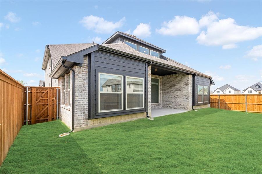 Exterior details and patio area of a home in Creekview Meadows, Pilot Point (Image 20). Exterior details and patio area of a home in Creekview Meadows, Pilot Point (Image 20).
