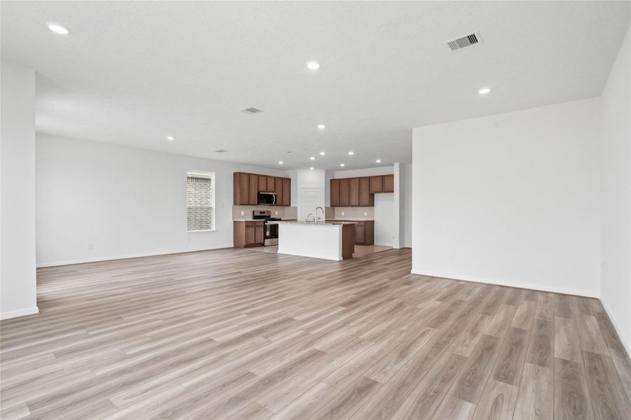 Thoughtfully designed, this open layout connects the family room, dining and kitchen, ensuring you remain effortlessly connected to guests and family. Thoughtfully designed, this open layout connects the family room, dining and kitchen, ensuring you remain effortlessly connected to guests and family.