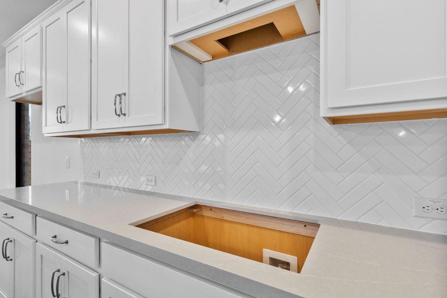 A close up of the classic but elegant backsplash.