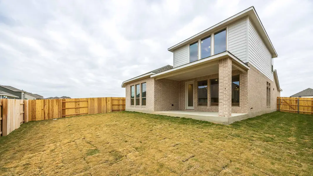 Exterior details and patio area of a home in Lariat 45', Liberty Hill (Image 2).