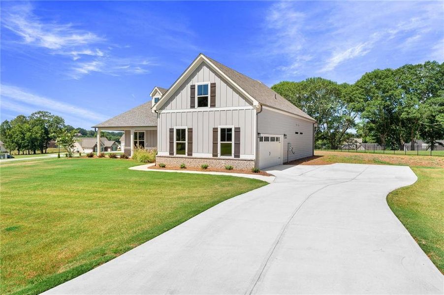 Front exterior of a new home in , Jefferson, GA, highlighting curb appeal (Image 20).