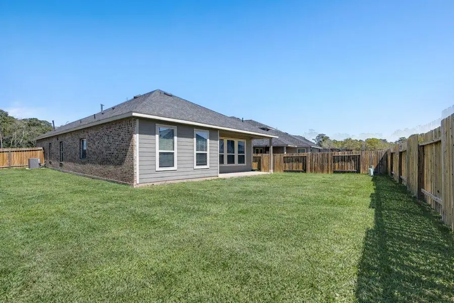 Exterior details and patio area of a home in Mill Creek Trails, Magnolia (Image 4).