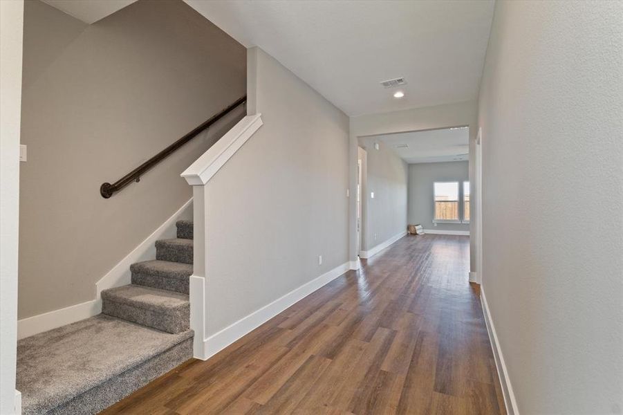 Hallway featuring wood-type flooring Hallway featuring wood-type flooring
