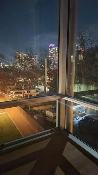 Master Bedroom North & East views of Dog Run & Downtown skyline at night