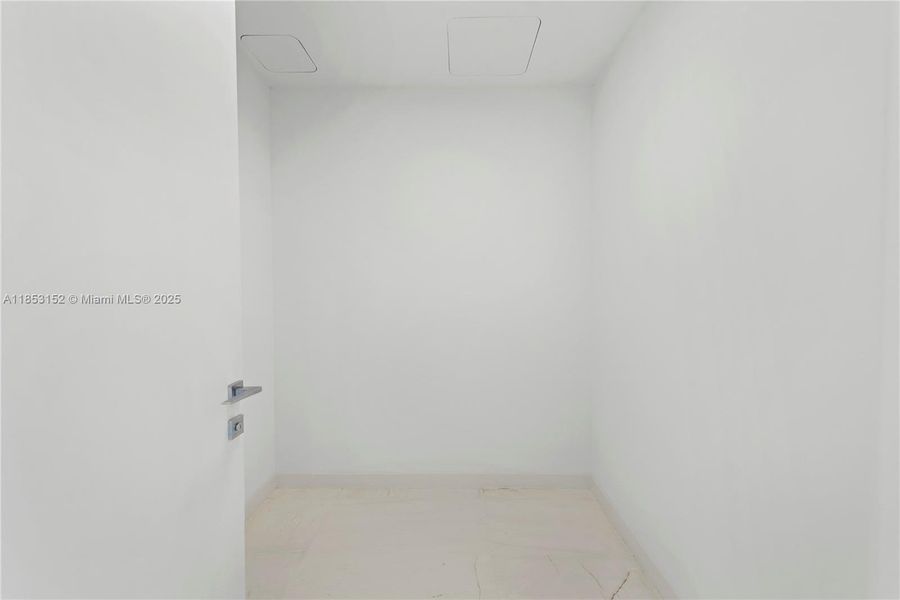 Spacious, unfurnished interior of a new home in Aston Martin Residences, Miami (Image 14).